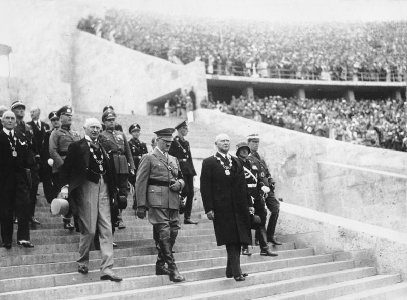 Adolf Hitler leading officials of the International Olympic Committee into the Berlin Olympic Stadium